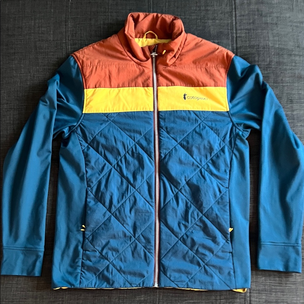 Cotopaxi Performance Jacket in Blue, Orange, and Yellow